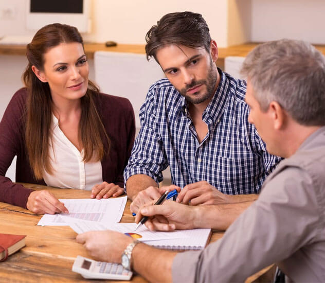 Couple reviewing homeowners insurance policy with a local agent in Coleman, TX